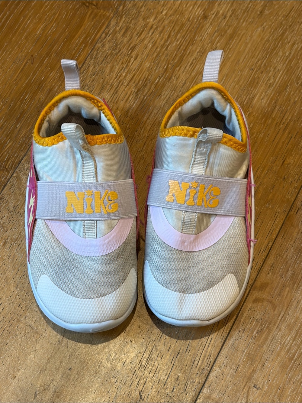 Nike Kids Slip-On Sneakers in White, Pink & Yellow Accent
